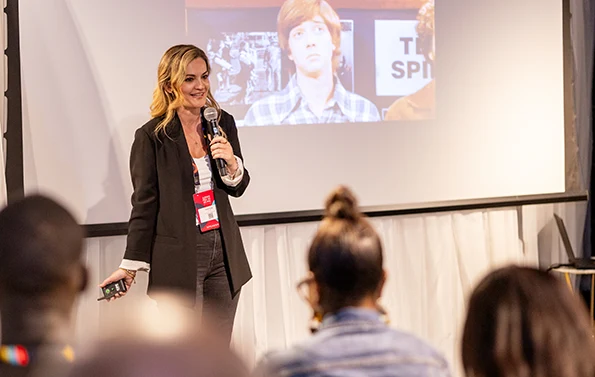 Sonia Couto speaking in front of a crowd